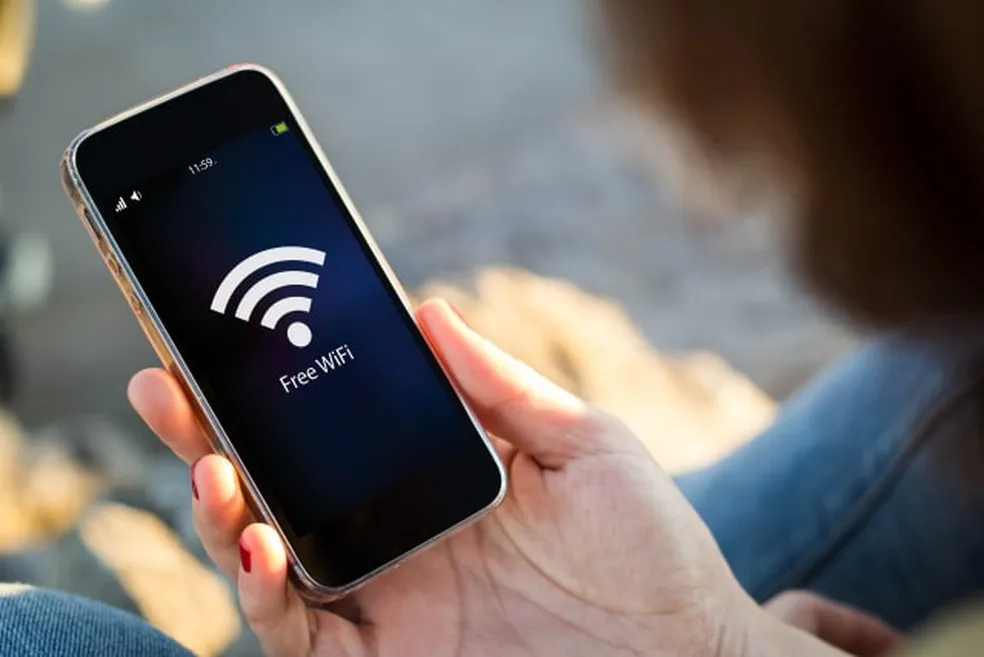 A modern, minimalist illustration depicting additional features of a mobile app. A transparent smartphone mockup in the foreground displays various app icons and UI elements. The middle ground features a serene city landscape with buildings and trees, suggesting the app's wider capabilities beyond basic WiFi connectivity. The background has a soft, slightly desaturated color palette, creating a calming, professional atmosphere. Warm, natural lighting from the left side casts subtle shadows and highlights the app's intuitive design. The overall composition conveys a sense of utility, simplicity, and the app's ability to enhance the user's urban experience.